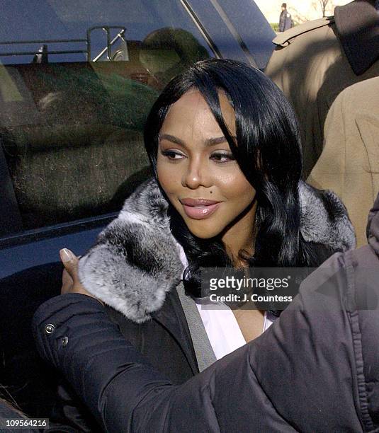 Rap star Lil' Kim, whose real name is Kimberly Jones, enters Manhattan federal court, Monday, March 14 in New York City. Jones is accused of lying to...