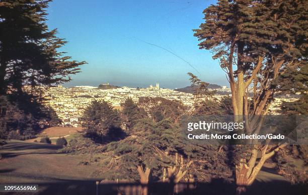 Birds-eye view facing east of San Francisco, California from the Presidio, June, 1950. At center in the distance is Coit Tower, and Saints Peter and...
