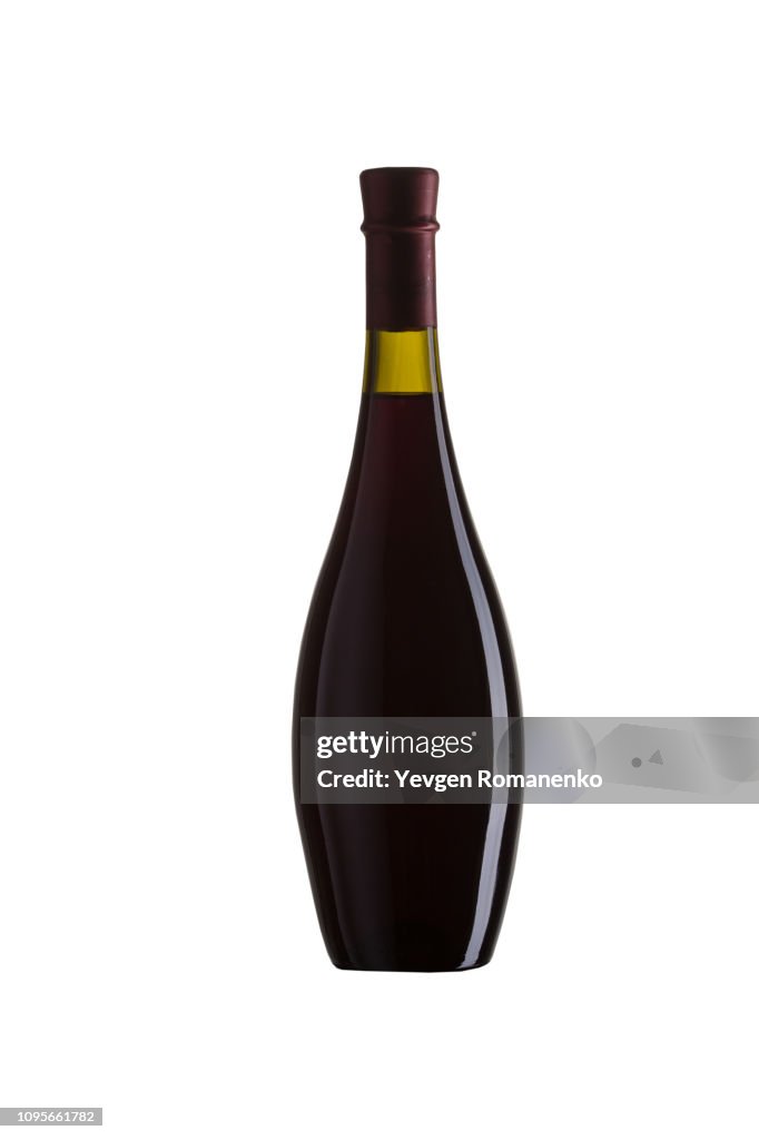 A bottle of red wine isolated over white background