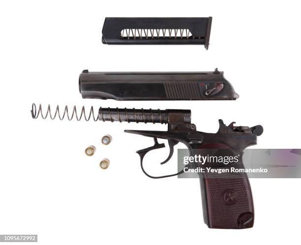 disassembled gun isolated on white background - gun-disassembly photos et images de collection