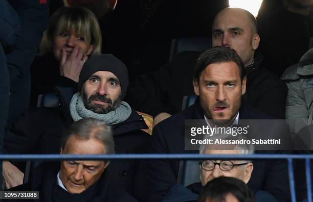 As Roma Sport director Ramon Rodriguez Monchi and Francesco Totti look on before the Serie A match between Chievo Verona and AS Roma at Stadio...