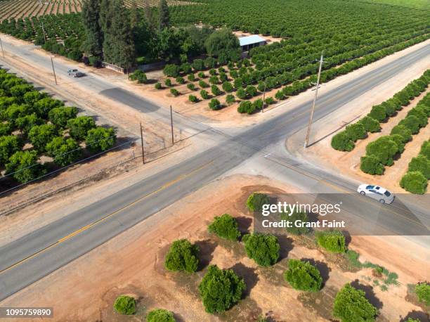 view of country road intersection. - country road aerial stock pictures, royalty-free photos & images