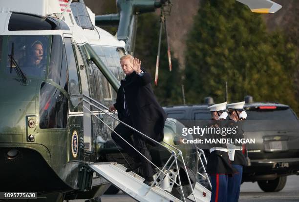 President Donald Trump boards Marine One as he departs from the Walter Reed National Military Medical Center in Bethesda, Maryland on February 8,...