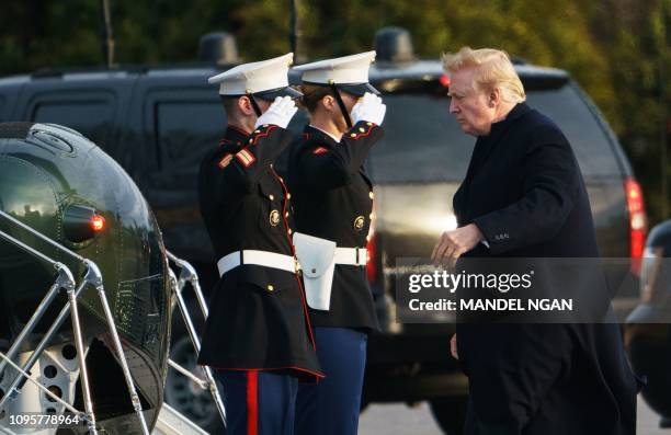 President Donald Trump boards Marine One upon departure from Walter Reed National Military Medical Center in Bethesda, Maryland on February 8, 2019....