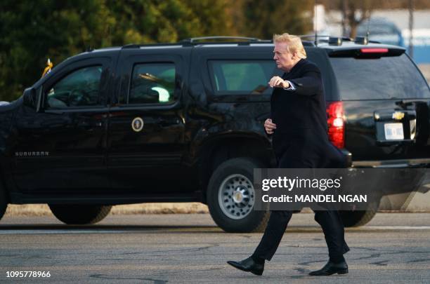 President Donald Trump boards Marine One upon departure from Walter Reed National Military Medical Center in Bethesda, Maryland on February 8, 2019....