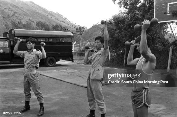 Police cadets lifting weights at the Fanling training school. 10MAY77, News Photo