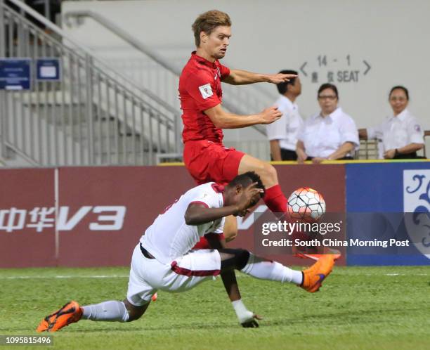 Jaimes McKee of Team Hong Kong with Mohammed Kasola of Team Qatar during the match Team Hong Kong vs Team Qatar of the 2018 FIFA World Cup...