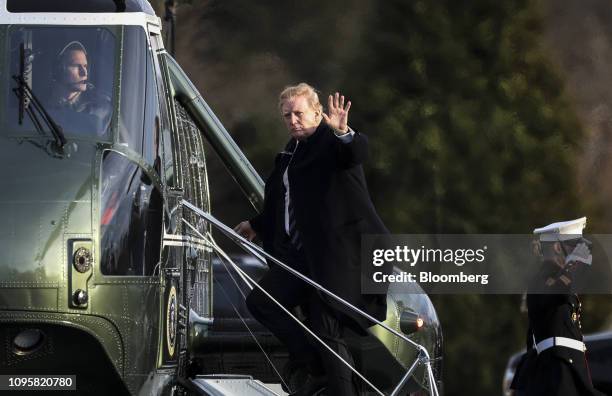 President Donald Trump waves while boarding Marine One after leaving Walter Reed National Military Medical Center in Bethesda, Maryland, U.S., on...