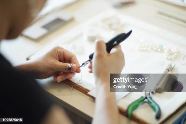 women making jewelry - jewellery stock pictures, royalty-free photos & images