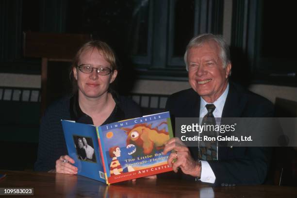 Amy Carter and Jimmy Carter during "The Little Baby Snoogle Fleejer" Autographing Party - December 13, 1995 at Barnes & Noble Bookstore in New York...