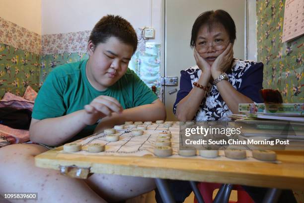 Xiao Youhuai and his grandmother Chow Siu-shuen now live in a small flat they rent in Shenzhen. 22SEP15