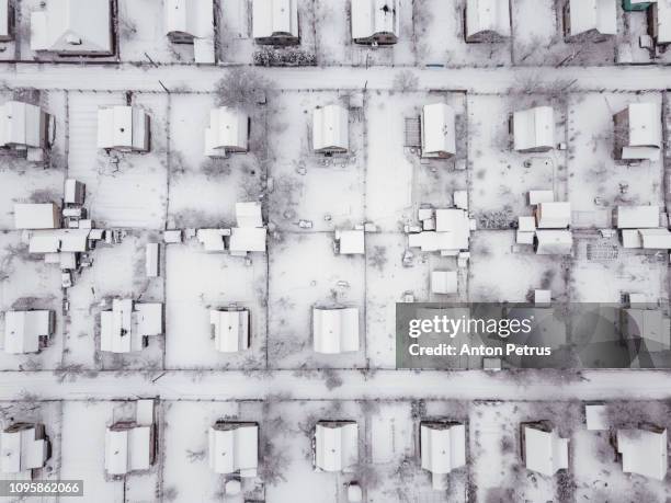 aerial view over private houses in wintertime - weiterentwicklung stock-fotos und bilder