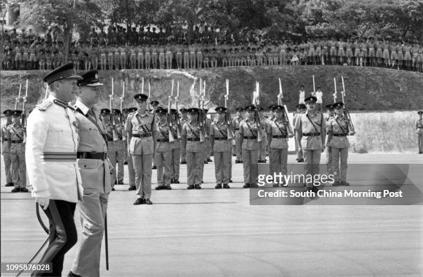 Sir John Archer , Commander of the British Forces, inspecting a passing-out parade staged by police cadets at the Police Training School. 14MAY77