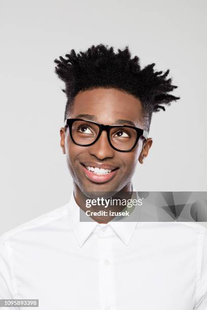 man looking away with a smile on face - white shirt stock pictures, royalty-free photos & images