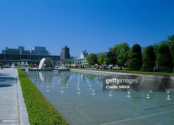 pond of peace, hiroshima, hiroshima, japan - hiroshima peace memorial park stock pictures, royalty-free photos & images