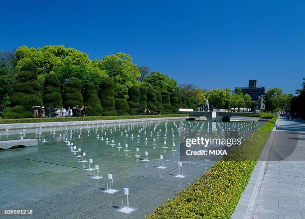 pond of peace, hiroshima, hiroshima, japan - hiroshima peace memorial park stock pictures, royalty-free photos & images