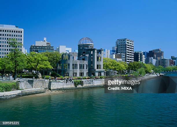motoyasu river and atomic bomb dome, hiroshima, hiroshima, japan - hiroshima peace memorial park stock pictures, royalty-free photos & images