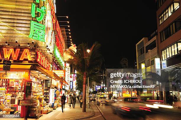 kokusai street at night - okinawa prefecture stock pictures, royalty-free photos & images