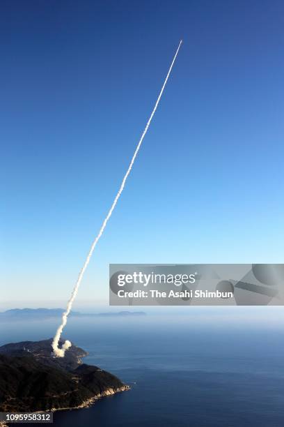 Epsilon-4 rocket leaves a contrail after the launch from the launch pad at the Japan Aerospace Exploration Agency Uchinoura Space Center on January...