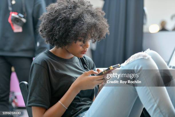 With makeup provided by Maybelline New York uses their mobile phone backstage Gallery I for Cushnie runway show during New York Fashion Week: The...