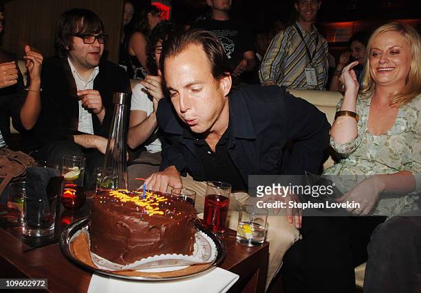 Will Arnett blows out the candle on his birthday cake