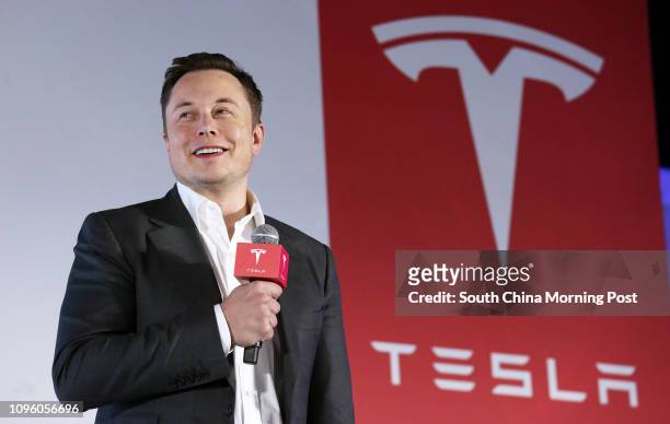 Tesla Motors CEO Elon Musk speaks to the media next to its Model S during a press conference in Hong Kong. 25JAN16 SCMP/ Nora Tam