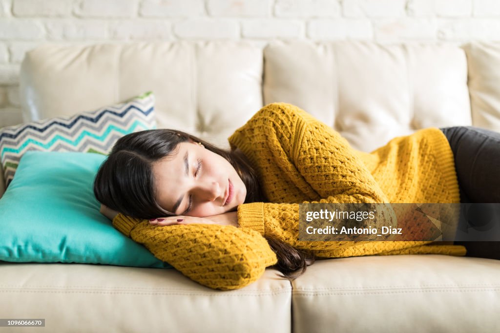 Woman Sleeping Comfortably In Living Room