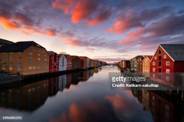 trondheim old town with colourful old warehouses in ovre elvehavn. - trondheim stock pictures, royalty-free photos & images