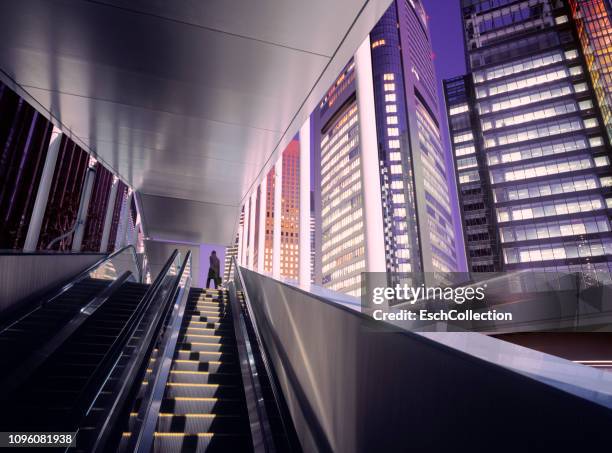 businessman on top of moving escalator at modern illuminated business district - launch of cinematic pictures publishings men of science fiction arrivals stockfoto's en -beelden