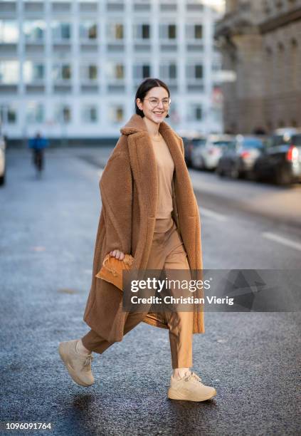 Maria Barteczko is seen wearing brown teddy coat Max Mara, brown sweater Joseph, brown trousers COS, brown plateau sneaker Zara, brown velvet pouch...