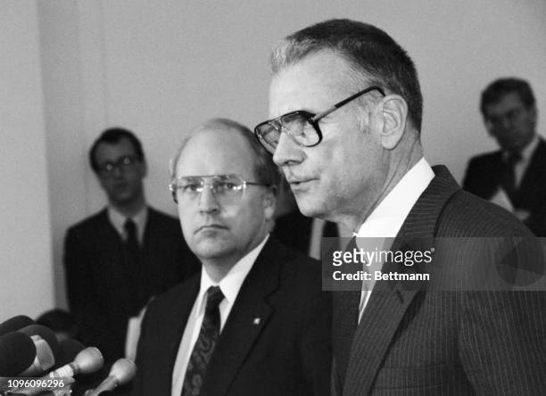 Representative Dick Cheney, R-WY , a member of the House Select Committee investigating the Iran-Contra scandal, and Representative Lee Hamilton,...