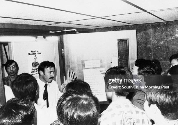 About 120 policemen try to storm the office of the Independent Commission Against Corruption in Hutchison House. They were angered with the ICAC's...