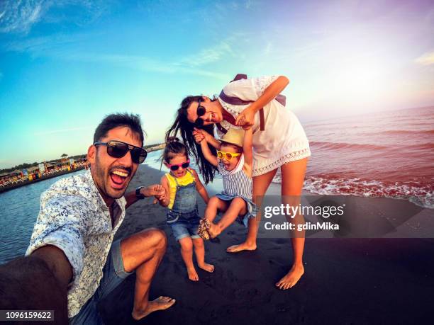 playful family selfie with wide angle camera - family trip in laws stock pictures, royalty-free photos & images
