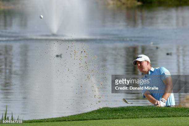 Tom Hoge of the United States hits out of the bunker on the 9th hole during the second round of the Desert Classic at La Quinta Country Club on...