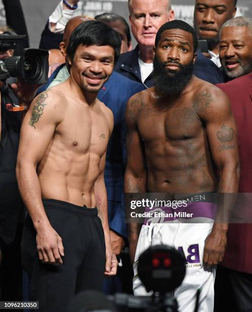 Welterweight champion Manny Pacquiao and Adrien Broner pose during their official weigh-in at MGM Grand Garden Arena on January 18, 2019 in Las...