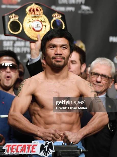 Welterweight champion Manny Pacquiao poses on the scale during his official weigh-in at MGM Grand Garden Arena on January 18, 2019 in Las Vegas,...