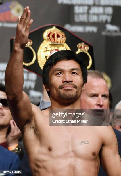 Welterweight champion Manny Pacquiao poses on the scale during his official weigh-in at MGM Grand Garden Arena on January 18, 2019 in Las Vegas,...