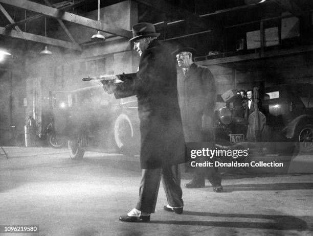 Actor George Raft holding a tommy gun in a scene from the movie "Some Like It Hot" in 1958.