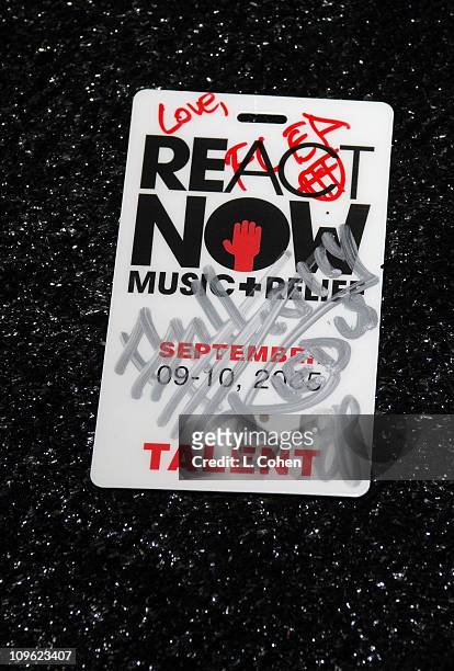 Signitures on sign and Flea donates his favorite shirt off his back after the Red Hot Chili Peppers perform at ReAct Now: Music & Relief on Saturday,...