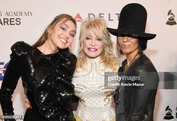 Miley Cyrus, Dolly Parton, and Linda Perry attend MusiCares Person of the Year honoring Dolly Parton at Los Angeles Convention Center on February 8,...