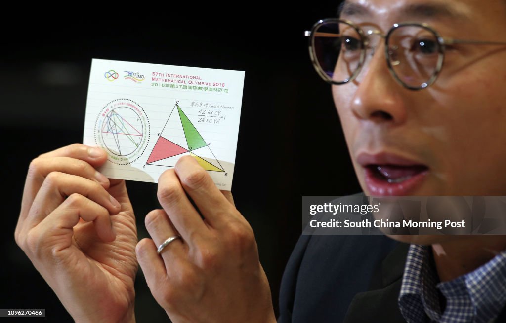 Nelvin Lee, senior manager (Philatelic Marketing) of Hong Kong Post, holds a stamp sheetlet on the theme of "57th International Mathematical Olympiad 2016", with associated philatelic products, which will be released for sale on 6 July. 04JUL16 SCMP/ Dav