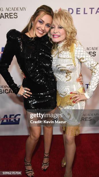Miley Cyrus and Dolly Parton attend MusiCares Person of the Year honoring Dolly Parton at Los Angeles Convention Center on February 8, 2019 in Los...