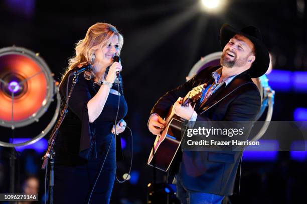 Trisha Yearwood and Garth Brooks perform onstage during MusiCares Person of the Year honoring Dolly Parton at Los Angeles Convention Center on...