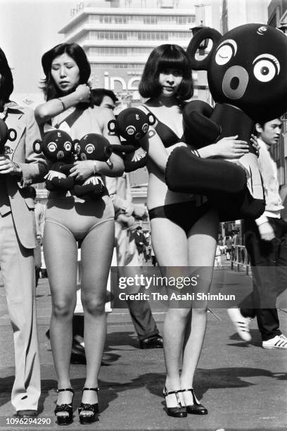 Models promote Dakko-Chan dolls 20th anniversary at Ginza district on March 9, 1975 in Tokyo, Japan.