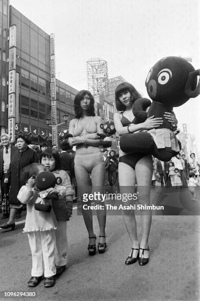 Models promote Dakko-Chan dolls 20th anniversary at Ginza district on March 9, 1975 in Tokyo, Japan.