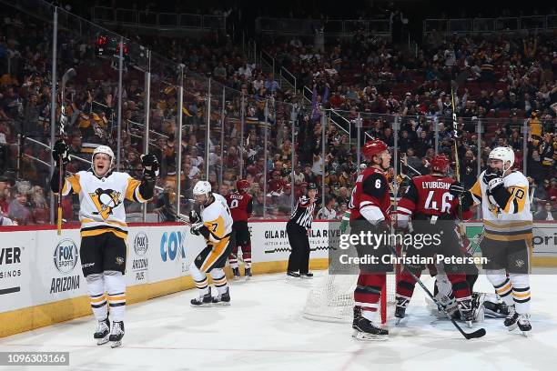 Jake Guentzel of the Pittsburgh Penguins celebrates alongside Matt Cullen after scoring a goal against the Arizona Coyotes during the second period...