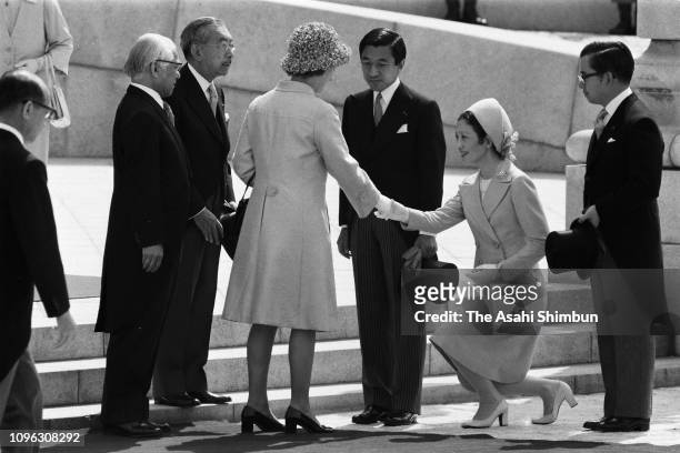 Queen Elizabeth II and Prince Philip, Duke of Edinburgh are introduced Crown Prince Akihito, Crown Princess Michiko and Prince Hitachi by Emperor...