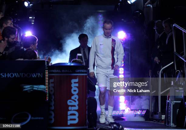 John McEnroe walks out to the court as he is introduced prior to playing his match against Ivan Lendl during the BNP Paribas Showdown at Madison...