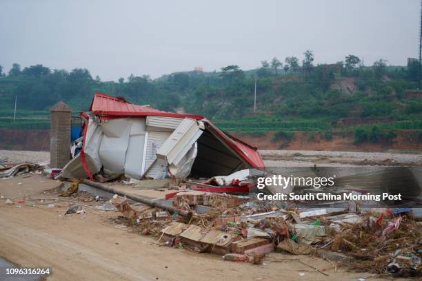 Guyi villager Liu Bingcheng was bitter that local officials, who often bragged about their ability to cope with disaster, had failed to prevent heavy...