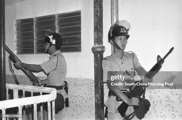 Geared-up policemen in a police-military exercise on Tsing Yi Island. 15SEP78